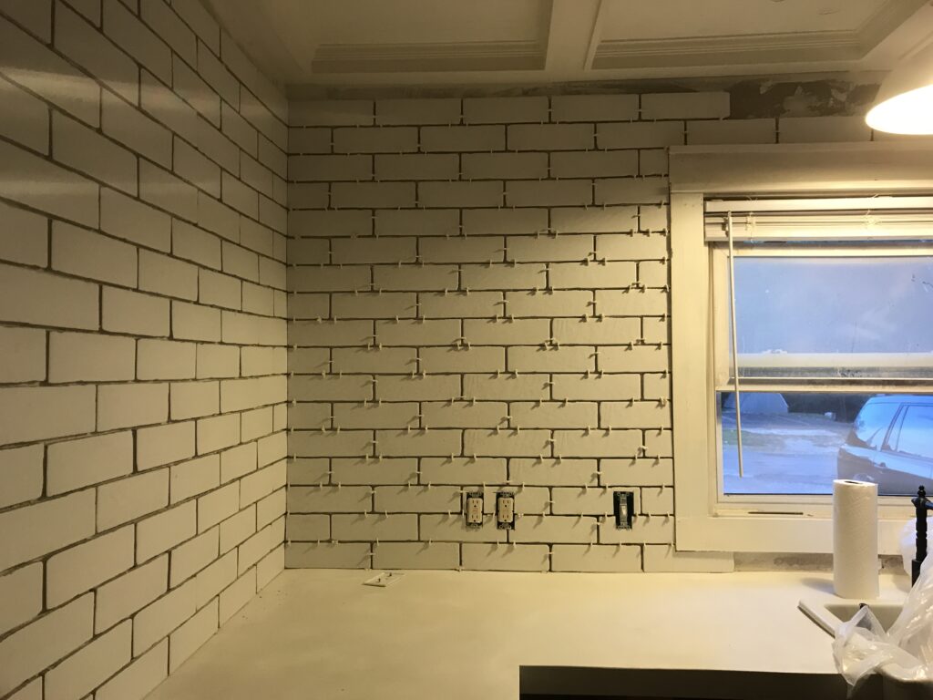 White faux brick tile backsplash for my old kitchen. Has the perfect old-world look, yet still new and fresh. The perfect porcelain tile backsplash.