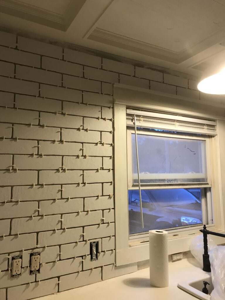 White faux brick tile backsplash for my old kitchen. Has the perfect old-world look, yet still new and fresh. The perfect porcelain tile backsplash.