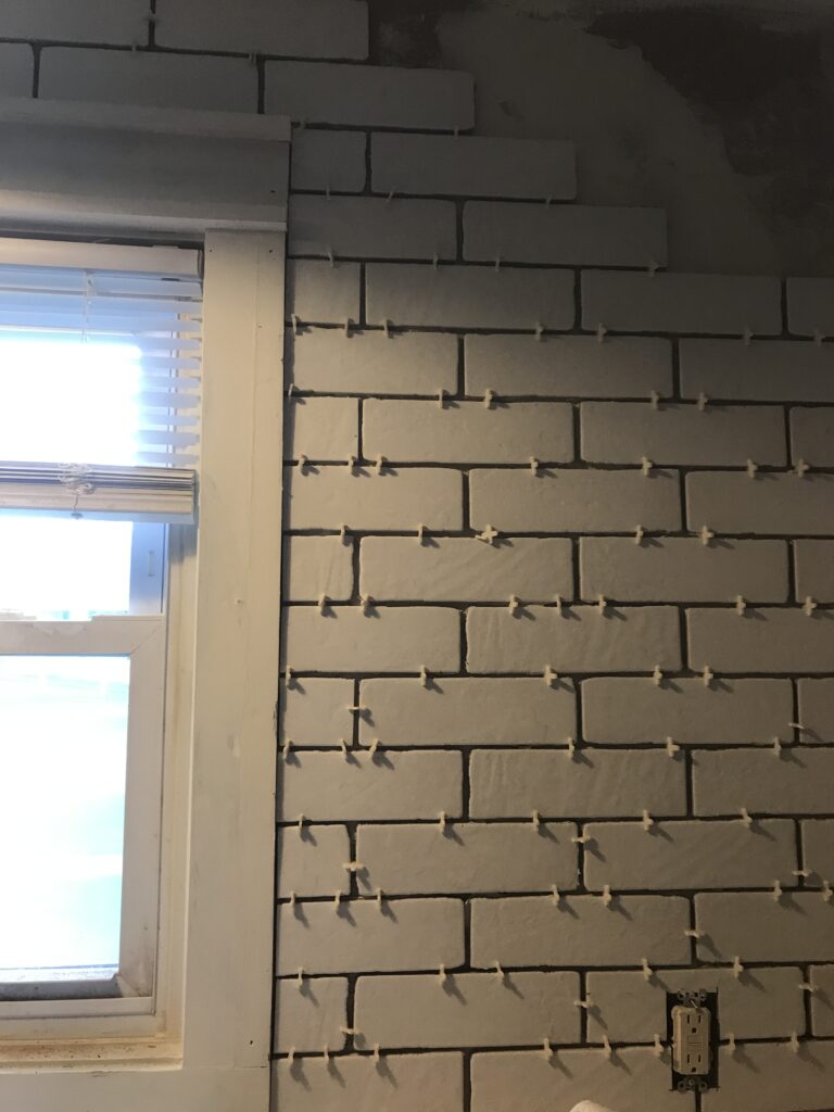White faux brick tile backsplash for my old kitchen. Has the perfect old-world look, yet still new and fresh. The perfect porcelain tile backsplash.