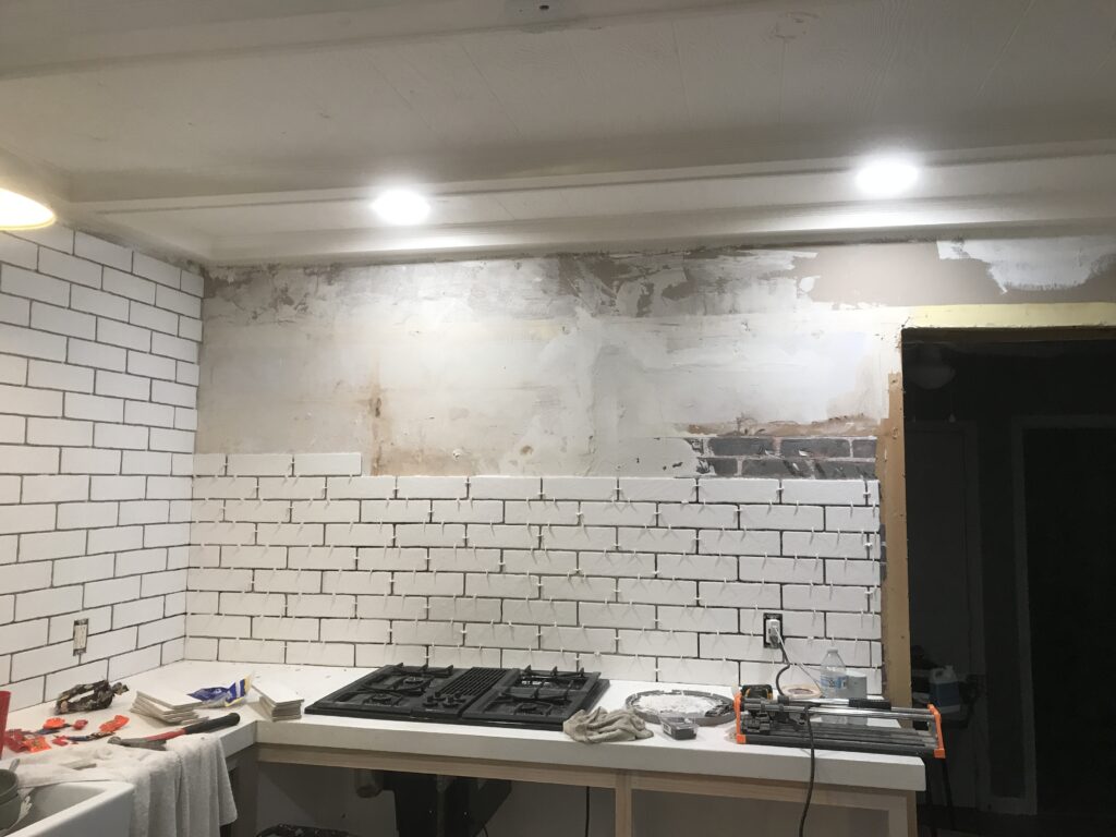 White faux brick tile backsplash for my old kitchen. Has the perfect old-world look, yet still new and fresh. The perfect porcelain tile backsplash.