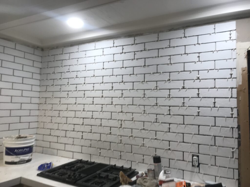 White faux brick tile backsplash for my old kitchen. Has the perfect old-world look, yet still new and fresh. The perfect porcelain tile backsplash.