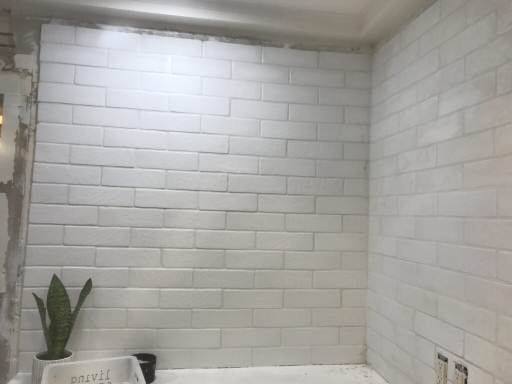 White faux brick tile backsplash for my old kitchen. Has the perfect old-world look, yet still new and fresh. The perfect porcelain tile backsplash.