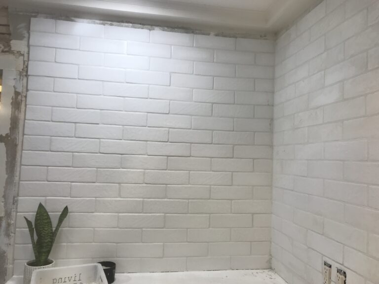 white tile backsplash with white grout