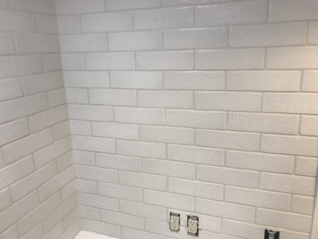 White faux brick tile backsplash for my old kitchen. Has the perfect old-world look, yet still new and fresh. The perfect porcelain tile backsplash.