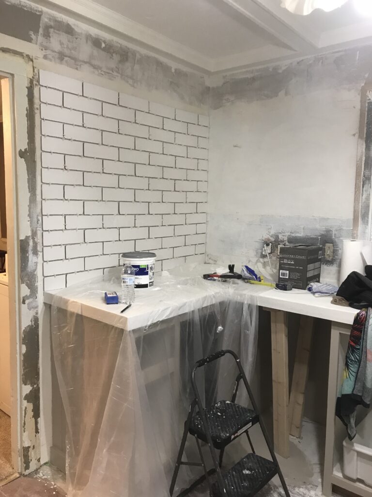 White faux brick tile backsplash for my old kitchen. Has the perfect old-world look, yet still new and fresh. The perfect porcelain tile backsplash.