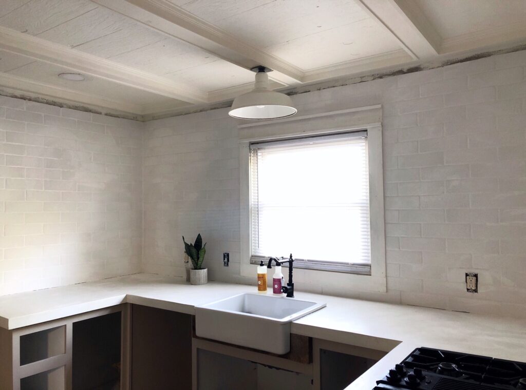 white brick tile with white countertops