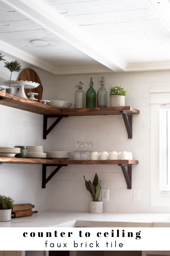 counter to ceiling white tile with wood open shelving. How to style open shelving. 