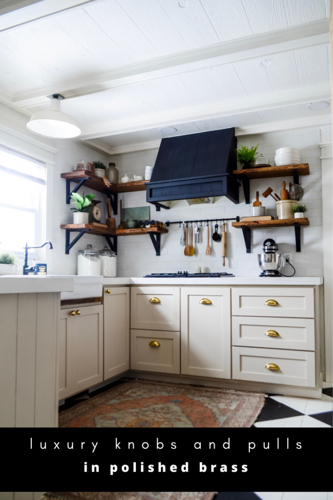 Brass kitchen hardware on mushroom tan cabinets. Brass cup pulls and round knobs in kitchen. Kitchen hardware. Affordable kitchen hardware. Black, white, ta, and brass kitchen.