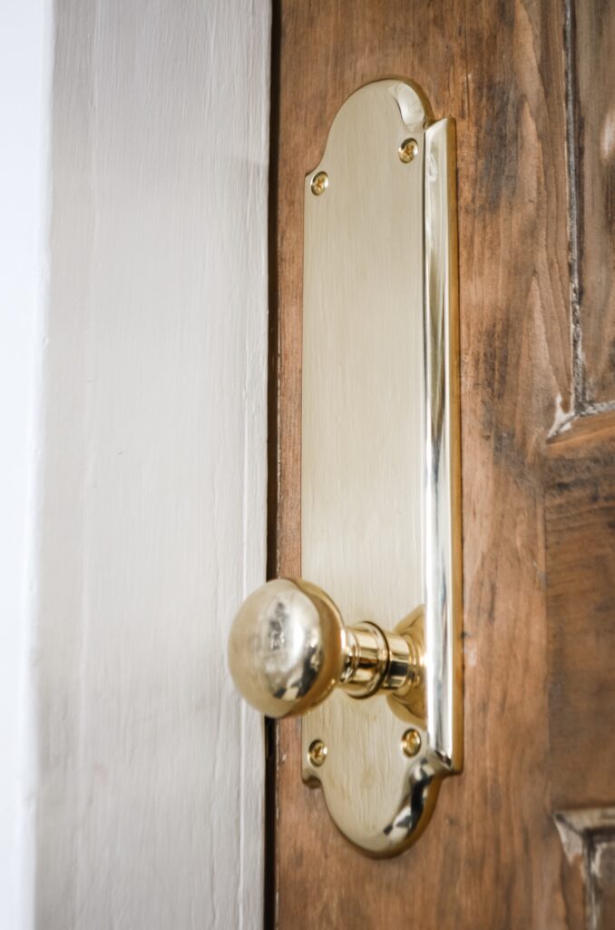 Brass doorknobs with tall rose