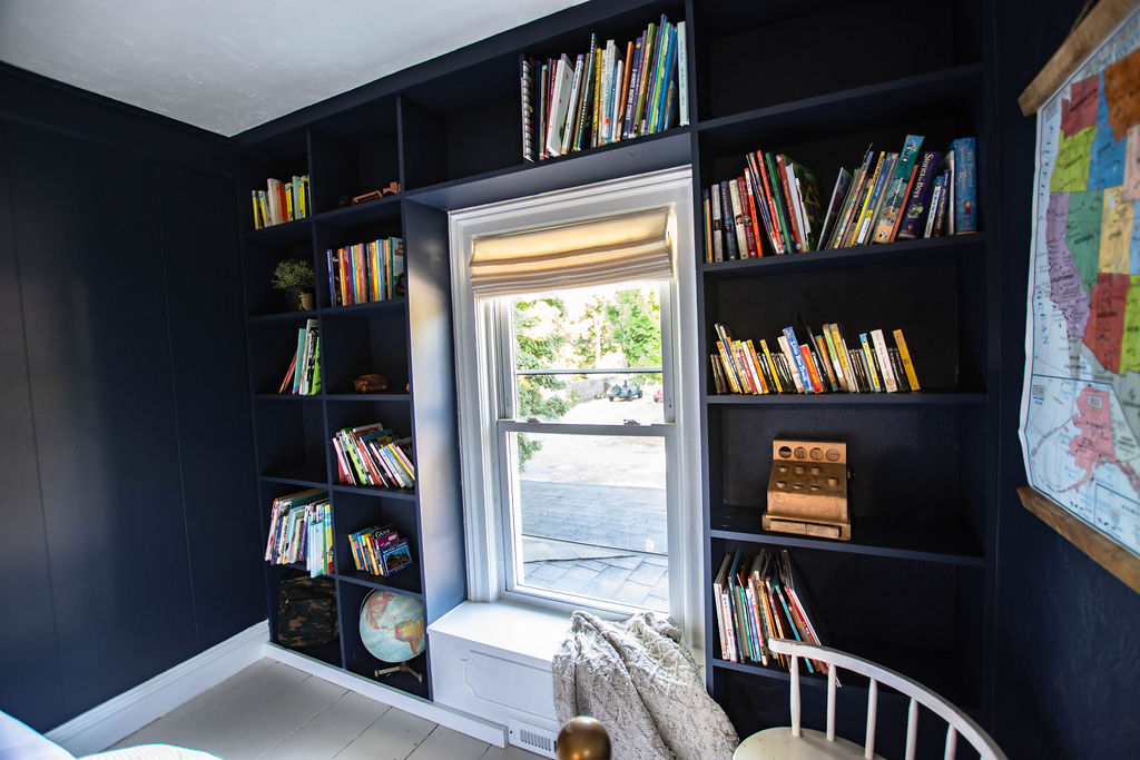 bookshelf wall around window